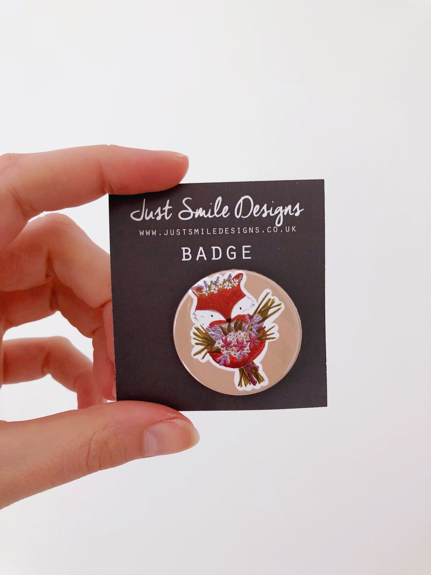 Fox with a bouquet badge