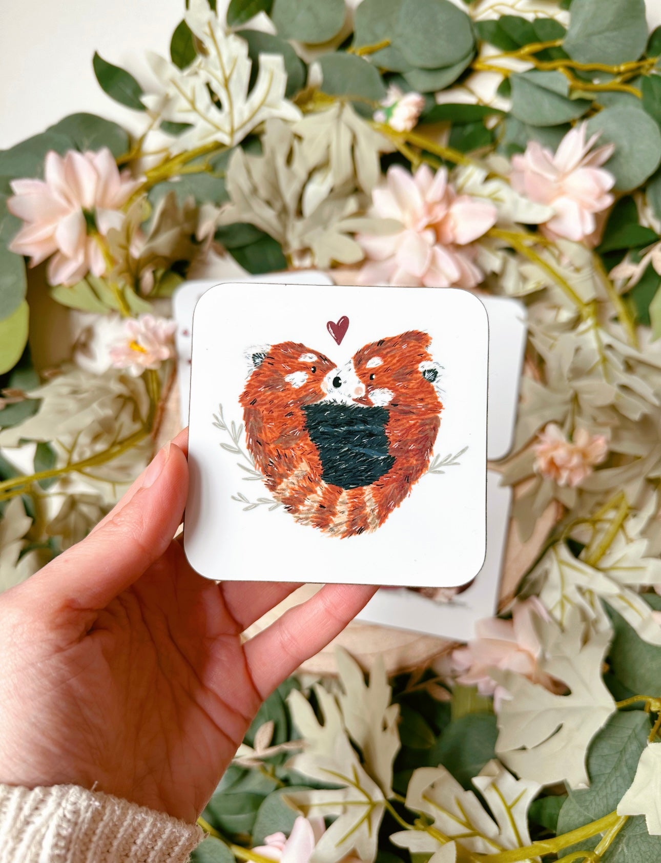 Red panda cuddling coaster